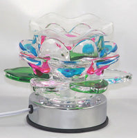 LED Oil Burner OIL BURNER. TURNS ON AND OFF BY TOUCHING THE CHROME PART OF THE LAMP. BIG LOTUS FLOWER DESIGN, THE PEDALS OF THE FLOWER ARE DIFFERENT COLORS.